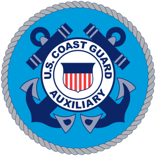 The Coast Guard Auxiliary is a volunteer organization that supports the U.S. Coast Guard in a variety of missions. It was founded in 1939 as the U.S. Coast Guard Reserve, and it was renamed the Coast Guard Auxiliary in 1941. The Auxiliary is made up of men and women who are interested in supporting the Coast Guard and promoting boating safety. Members of the Auxiliary may participate in a variety of activities, such as conducting vessel safety checks, teaching boating safety courses, and assisting with search and rescue missions. They may also assist with marine safety patrols, environmental protection efforts, and other Coast Guard missions.